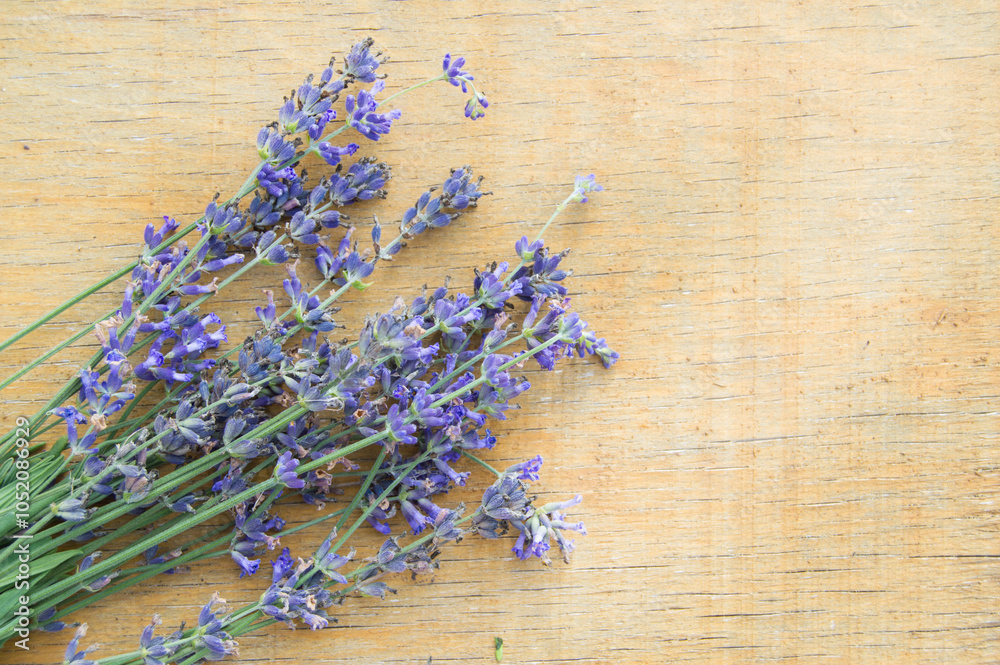 Wall mural Bouquet of lavender flowers in Provence style on a wooden background, selective focus