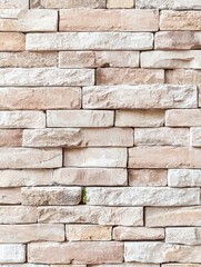 Fototapeta premium Textured stone wall background featuring varied tones of beige and cream ideal for interior design and architecture projects