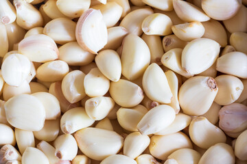 Group of fresh peeled garlic, display on traditional market in Indonesia. Full picture of garlic