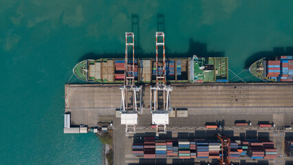 Top view of riverside with container ship in import export business logistic by crane ,Bangkok...