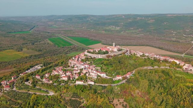Croatia, picturesque aerial footage of mediaeval town and fortress Motovun, located on the top of a high hill on Istrian peninsula. The city is famous for its local wineries and truffle forest