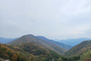 Fototapeta premium magnificent mountain landscape. Hiking and mountaineering. Mountain paths and stone steps. peak. Seasons in the mountains: autumn - winter - spring - summer. Hiking in the mountains