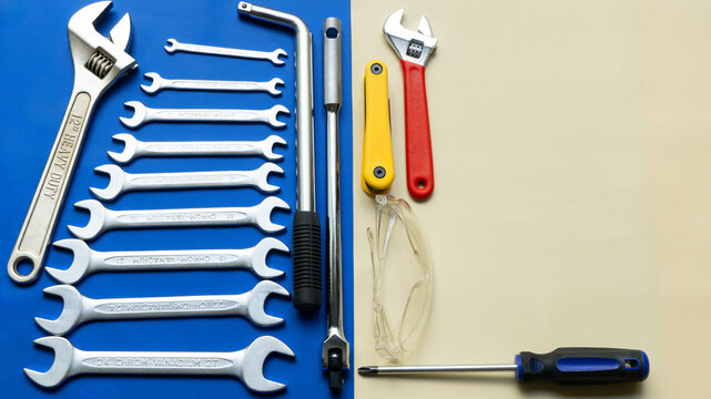 Happy Labor Day or Happy Father's Day setup concept with copy scape; Blue collar worker everyday tools 