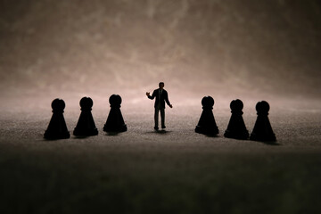 Miniature people toy figure photography. Strategy decision concept. A businessman standing in the...