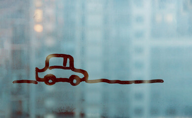 doodle car driving down the road on blue foggy glass window