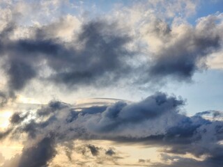 black clouds obscured the sun. white sun through black clouds. ominous atmosphere. climate change.