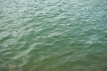 Smooth surface of water on a mountain lake.