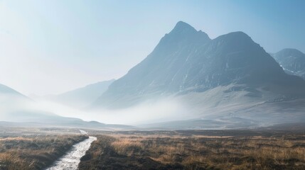 Misty mountain path. Serene landscape photo; misty valley, tranquil path, majestic peaks.  Symbolizes peace, journey.