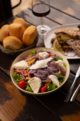 Rib fillet with salad red wine