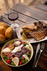 Rib fillet with salad red wine