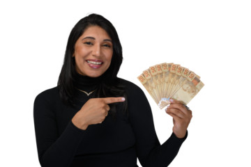 woman holding a fan of Brazilian money, smiles happily