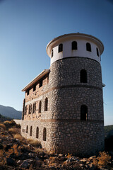 Fototapeta premium the tower of the old stone castle by the sea