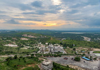 Obraz premium Scenic Aerial view of Mountains with dramatic sunset Cloudy evening Sky