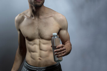 A young shirtless muscluar man