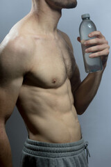 A young shirtless muscluar man