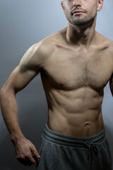 A young shirtless muscluar man