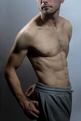 Naklejka premium A young shirtless muscluar man