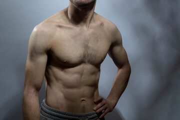 Obraz premium A young shirtless muscluar man