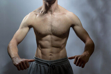 A young shirtless muscluar man