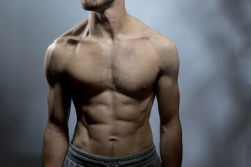 A young shirtless muscluar man