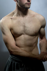 Obraz premium A young shirtless muscluar man