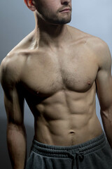 Fototapeta premium A young shirtless muscluar man