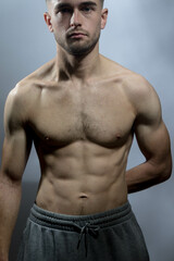 Obraz premium A young shirtless muscluar man