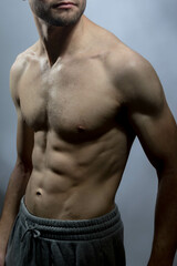 A young shirtless muscluar man