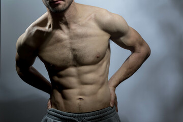 A young shirtless muscluar man