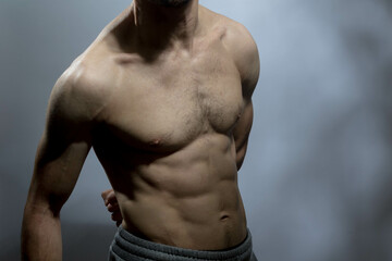 A young shirtless muscluar man