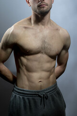 Fototapeta premium A young shirtless muscluar man