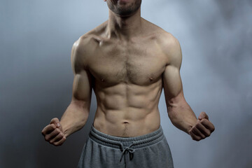 Obraz premium A young shirtless muscluar man