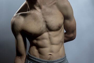 A young shirtless muscluar man