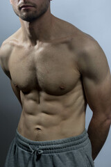 A young shirtless muscluar man