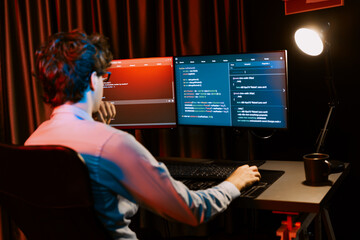 Working IT developer concentrating online software development information on surrounded by coding...
