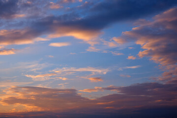 Beautiful sunset sky with pink colors clouds.