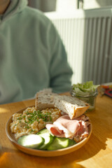 Healthy and tasty toast bread with cucumbers, eggs, ham and cheese on it.