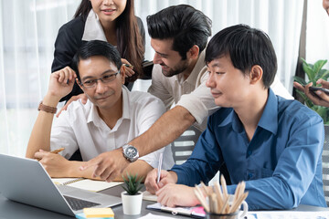 Group of diverse office worker employee working together on strategic business marketing planning in corporate office room. Positive teamwork in business workplace concept. Prudent