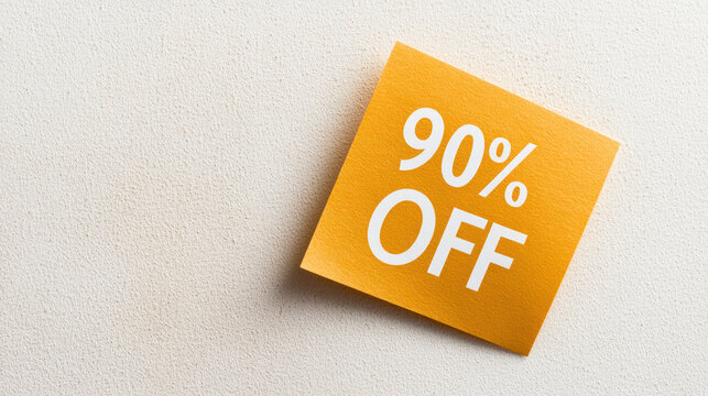 90% off promotional note on gold square paper against light background, conveying sense of urgency and excitement for savings