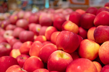 Red apples display in supermarket. Produce market display.