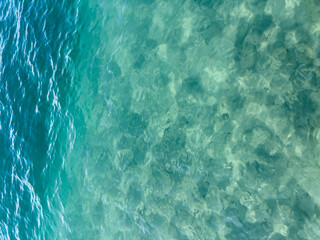Texture of blue calm water creates a serene and peaceful background. The natural beauty of water...