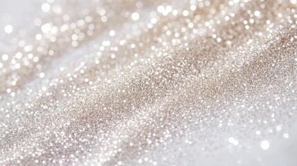 Shimmering silver and cream glitter swatches gleam on a stark white canvas, creating an ethereal and captivating display.