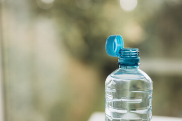 new design of plastic cap on bottles. a cap that is always on the bottle.