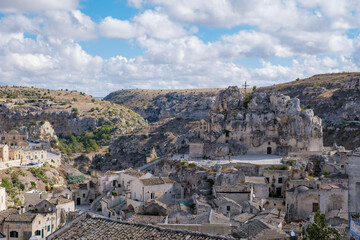 Obraz premium Explore the enchanting rock formations and ancient architecture of Matera in Puglia, Italy