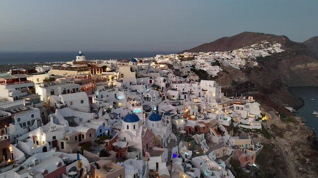 Aerial view of Oia village at sunset, Santorini island, Greece