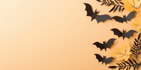 Halloween concept, paper cut art of black bat, autumn leaves and cobweb on light pastel orange background with copy space
