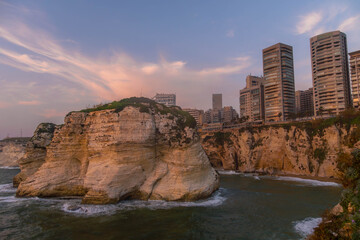 Naklejka premium Beirut city with famous Pigeons' Rock (Raouche rocks) on the Mediterranean sea coastline with modern architecture in Lebanon. 