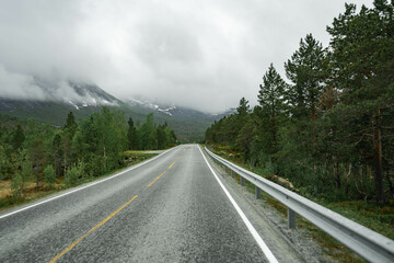 Empty road in a moody norway mountain landscape