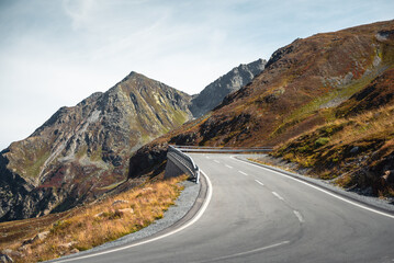 Flüela Pass mountain road on sunny afternoon. Mountain pass hairpin in Swiss apps, Piz dal Ras and...