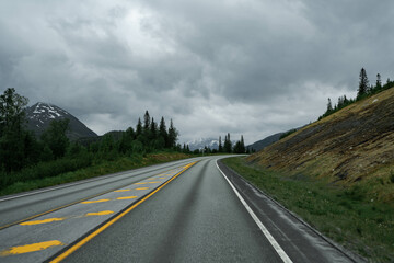 Empty road in a moody norway mountain landscape